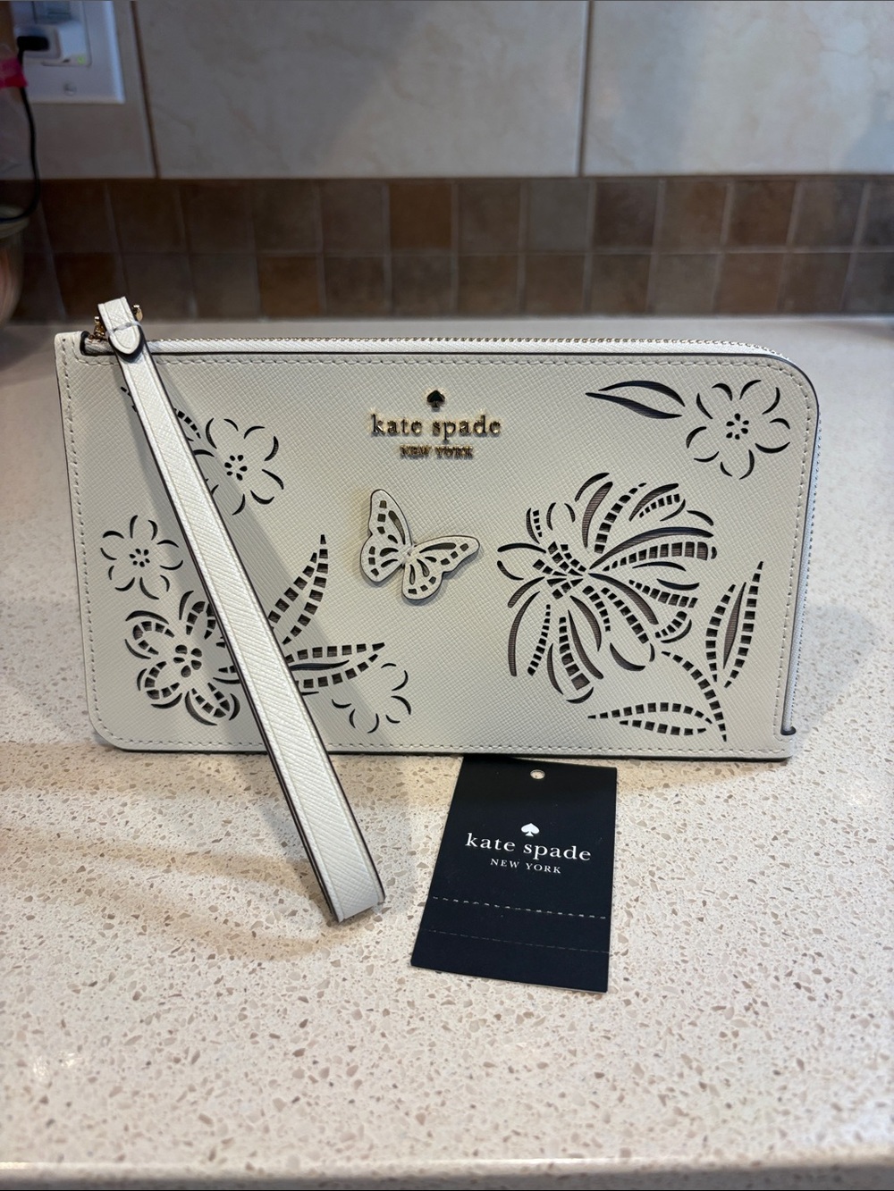 kate spade Lucy NWT Ivory floral & butterfly cutout wristlet MSRP $159 - Picture 1 of 8